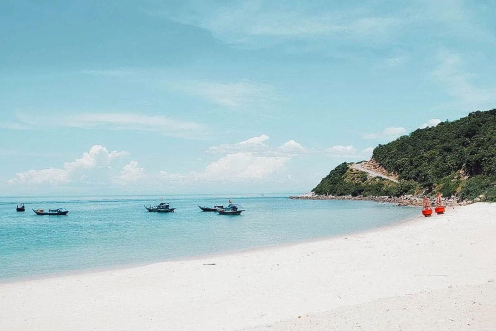 Cham Island maintains wild beauty with clear blue water, white sand, and a diverse ecosystem
